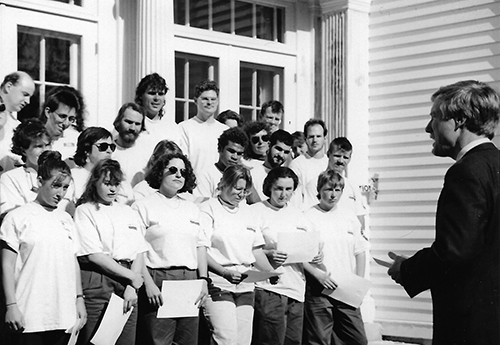 Then-Governor Angus King swearing in AmeriCorps members who are standing on south steps of Blaine House