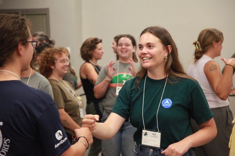 AmeriCorps member engaging with other volunteer managers and coordinators at the 2025 Maine Volunteer Leadership Conference